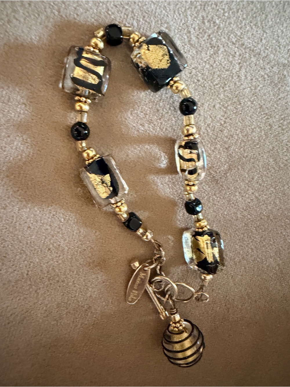 Gold and Black Glass Bead Bracelet with Decorative Charm